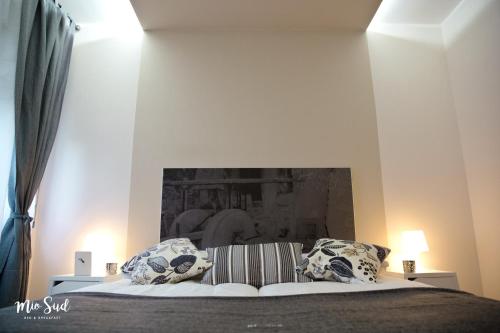 a bedroom with a bed with two pillows on it at Mio Sud in Cosenza