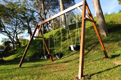 an empty swing set in a park at Río Arriba Suites & Apartments & Restó in Bella Vista