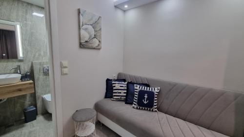 a couch with pillows on it in a bathroom at Agia Lydia Sea View Suite House in Karianí