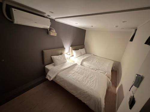 Postel nebo postele na pokoji v ubytování About Stay Dongdaemun