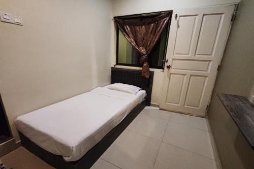 Letto o letti in una camera di Heaven Mountain Hill Hotel 1 Cameron Highlands
