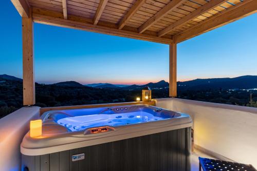 a hot tub on the balcony of a house at Alkema Horizon in Philotium
