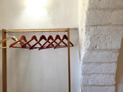 a rack of red wine bottles on a wall at Dimora La Piana in Ostuni