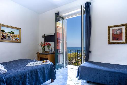 Katil atau katil-katil dalam bilik di Hotel Il Faro