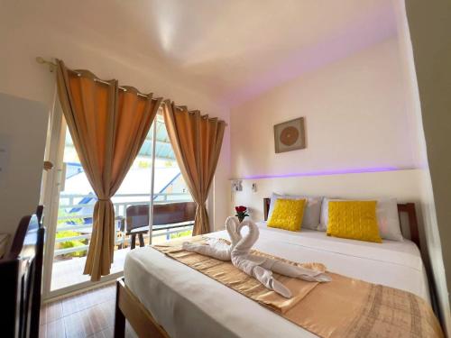 Postel nebo postele na pokoji v ubytování Foxtail Siargao Island Guesthouse
