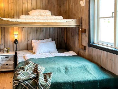 a bedroom with a bunk bed in a room at 10 person holiday home in veggli-By Traum in Veggli