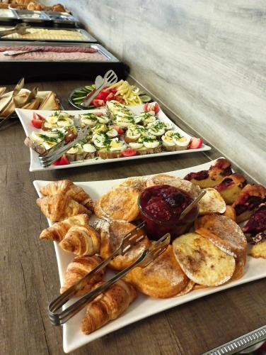 two plates of food on a table with appetizers at Hotel Barborka in Přední Výtoň
