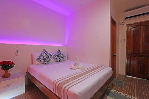 Postel nebo postele na pokoji v ubytování Foxtail Siargao Island Guesthouse