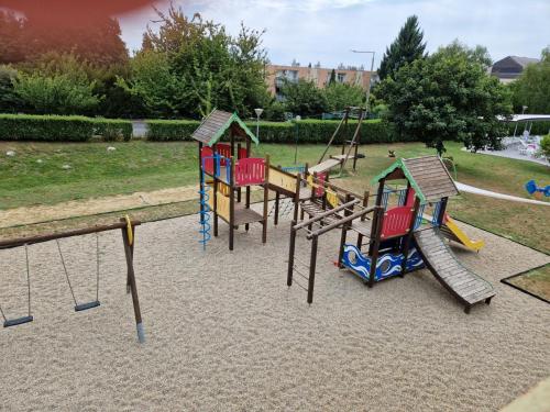 a group of playground equipment in a park at Zalakaros Wellness Apt Relax w Spa, Pool & AC in Zalakaros