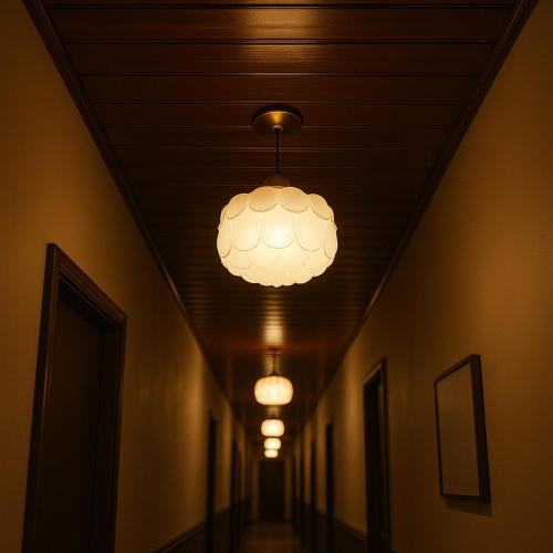 a hallway with lights on the ceiling of a building at Gangneung Harubam in Gangneung