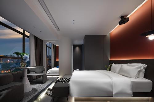 Postel nebo postele na pokoji v ubytování Enji M Hotel-Xi’an datangbuyecheng