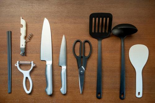 a group of utensils sitting on top of a table at Silk Court 301 in Chitose