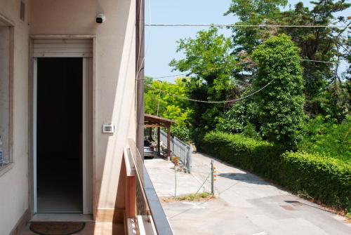 an open door to a building with a sidewalk at A due passi dal mare - Oasi di pace in Petacciato