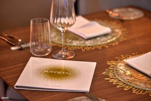 a table with two glasses and a plate with a napkin at Hotel Riu Palace Calypso - Adults Only in Playa Jandia