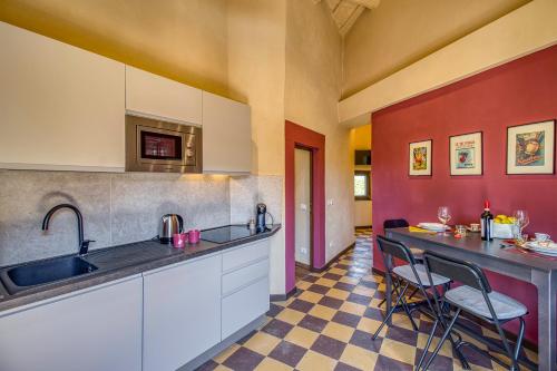 a kitchen with a sink and a counter at Romantic Apartment In Chianti Classico - Happy Rentals in Castelnuovo Berardenga