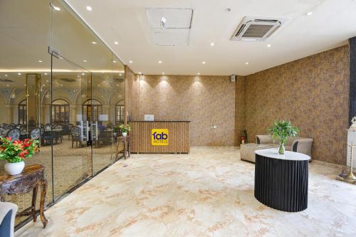 a lobby of a hotel with a reception desk at Oriva Ganeshwaram 149 in Greater Noida