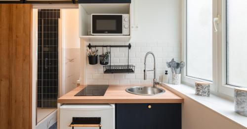 Η κουζίνα ή μικρή κουζίνα στο Confort - RDC - WIFI - Lave-linge & Terrasse