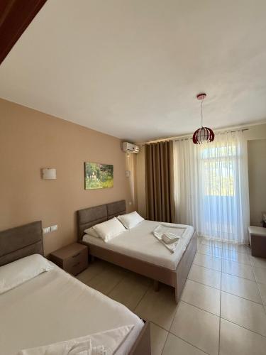 Postel nebo postele na pokoji v ubytování Divjaka Resort