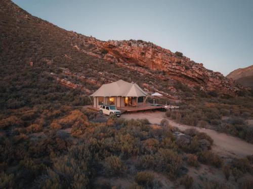 a luxury tent in the middle of a mountain at Elements Luxury Tent in Goedgemond