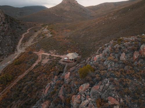 an aerial view of a house on a mountain at Elements Luxury Tent in Goedgemond
