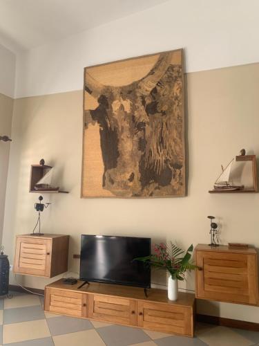 Televisyen dan/atau pusat hiburan di La Colombine Appart'Hôtel
