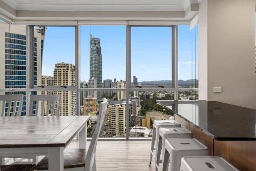 a dining room with a view of the city at Chevron Renaissance - Private Apartments - Hosted by Coastal Letting Co. in Gold Coast