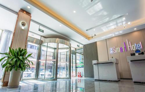 Vstupní hala nebo recepce v ubytování 沃德smart酒店德州汽车站店