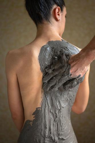 a woman in a dress with her back turned at Hotel Apollo Terme in Montegrotto Terme