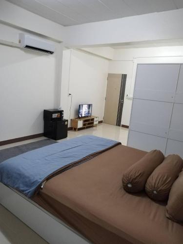 Ένα ή περισσότερα κρεβάτια σε δωμάτιο στο Homey Place 2