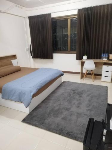Ένα ή περισσότερα κρεβάτια σε δωμάτιο στο Homey Place 2