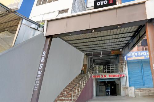 an entrance to a building with a stairway in front at Hotel O SRS Inn Guest House in Gorakhpur