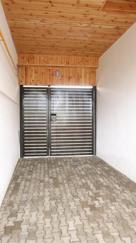 an empty room with a garage with a window at CASA Bia in Haţeg