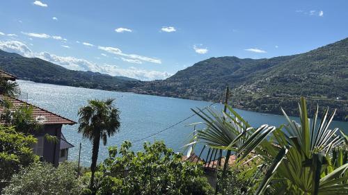 a view of a lake with mountains in the background at Romantic Room AL RIFUGIO DEI SOGNI terrazza con vista lago mozzafiato in Blevio