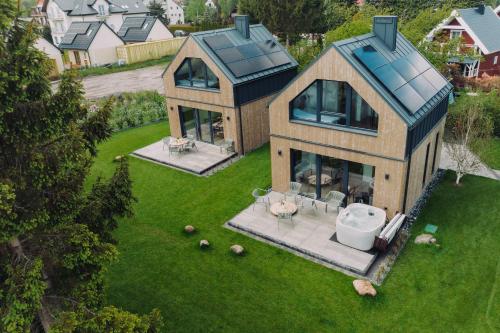 an aerial view of a house with a yard at BialogoraChill11C in Białogóra