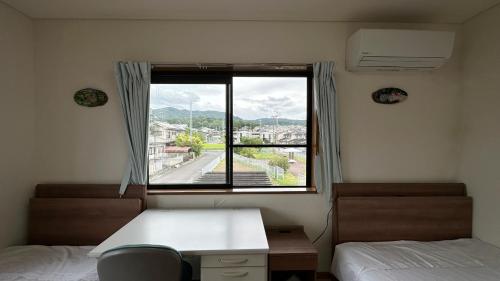 Postel nebo postele na pokoji v ubytování 中山民宿奈良若草山下的乡间别墅
