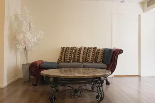 a living room with a couch and a coffee table at 2 Or 3 Bedroom Condo Walk To Mgm Casino And Strip in Las Vegas