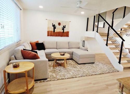 a living room with a couch and a table at Osborn Oasis - Stay for 4 in Scottsdale