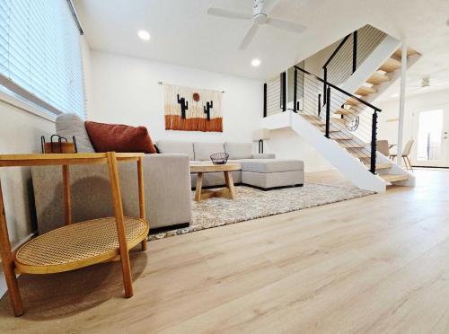 a living room with a couch and a table at Osborn Oasis - Stay for 4 in Scottsdale