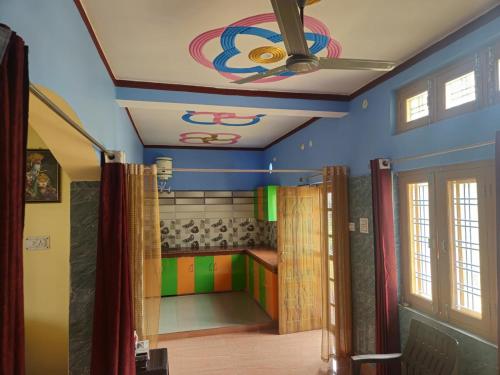 a room with a ceiling with a painting on it at Hill View 1BHK in Uttarkashi in Uttarkāshi