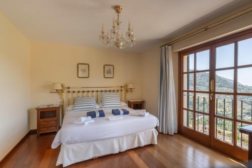 Ένα ή περισσότερα κρεβάτια σε δωμάτιο στο Cas Llonguet