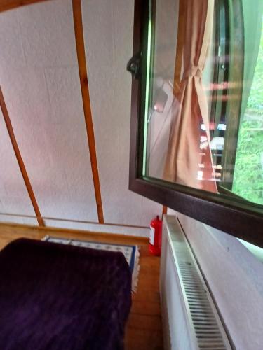 an empty room with a window on a train at Chalet A Frame Sinaia in Sinaia