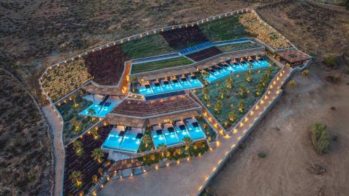 an overhead view of a building with a pool at Ftelia Black Villas in Elia