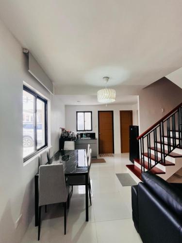 a living room with a table and a dining room at House For Rent in Lapu-Lapu City, Cebu in Dapitan