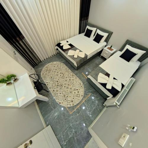 an overhead view of a living room with two beds and a couch at PRETTY HOUSE in Pamukkale