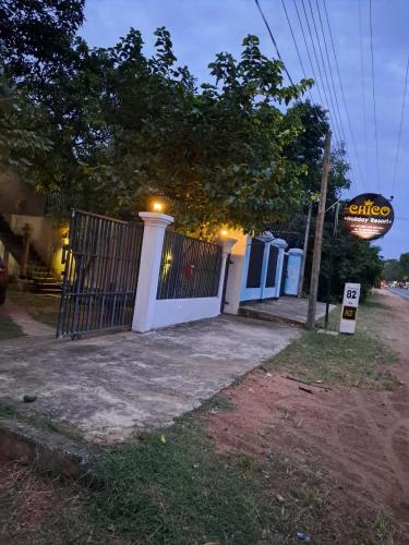 a gate in front of a house with a sign at Chico Holidey Resort in Anuradhapura
