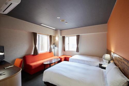 Smile Hotel Miyakojimaにあるベッド