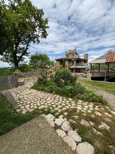 a stone path in front of an old building at Etno Rekreacia Tabatadze, With in Door & Out door pool 