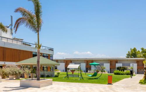 a playground in front of a building at Nof Ginosar Kibbutz Hotel in Kibbutz Ginnosar