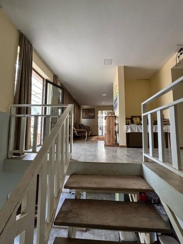 a stairway with a wooden bench in a room at Etno Rekreacia Tabatadze, With in Door & Out door pool 