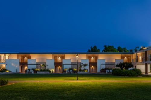 an exterior view of a building at night at Nof Ginosar Kibbutz Hotel in Kibbutz Ginnosar